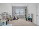 Bright playroom featuring ample space, large window, and neutral tones perfect for a growing Gathering at 11279 Amber Ridge Dr, Zellwood, FL 32798