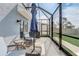 View of screened patio with patio furniture and backyard access through a sliding door at 11279 Amber Ridge Dr, Zellwood, FL 32798