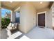 Inviting front porch features a cozy seating area, perfect for enjoying the outdoors at 1155 Seburn Rd, Apopka, FL 32703