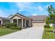 Lovely single-story home features manicured lawn, mature trees, and a covered front porch at 1155 Seburn Rd, Apopka, FL 32703