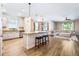 Open-concept kitchen and living area with granite countertops and stainless steel appliances at 1155 Seburn Rd, Apopka, FL 32703