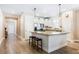 Modern kitchen with a center island, granite countertops, stainless steel appliances, and breakfast bar at 1155 Seburn Rd, Apopka, FL 32703