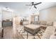 Open-concept living space featuring wood floors, neutral tones, and plenty of room for furniture at 1155 Seburn Rd, Apopka, FL 32703