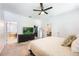 Spacious main bedroom with en-suite bathroom, walk-in closet, and view of the living room at 1155 Seburn Rd, Apopka, FL 32703