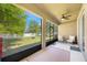 Screened patio with ceiling fan overlooking a spacious fenced backyard at 1155 Seburn Rd, Apopka, FL 32703