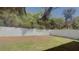 Large backyard with healthy green grass and a white privacy fence at 118 Hurst Ct, Deland, FL 32724