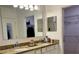 Bathroom featuring a double sink vanity with granite countertops and a large mirror at 118 Hurst Ct, Deland, FL 32724