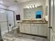 Bathroom with a glass enclosed shower, double sink vanity, and wood look tile flooring at 118 Hurst Ct, Deland, FL 32724