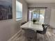 Dining area featuring a bright window with lots of natural light and a modern table at 118 Hurst Ct, Deland, FL 32724