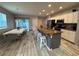 Open concept kitchen featuring an island, white cabinetry and stainless steel appliances at 118 Hurst Ct, Deland, FL 32724