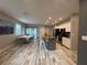 Open concept kitchen and dining area, featuring granite countertops and stainless steel appliances at 118 Hurst Ct, Deland, FL 32724