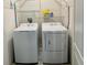 Laundry room with a side-by-side washer and dryer and shelving for storage at 118 Hurst Ct, Deland, FL 32724