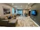 Open concept living room featuring wood-look flooring and a cozy sectional sofa at 118 Hurst Ct, Deland, FL 32724