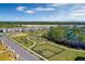 Aerial view featuring a community dog park and playground next to the lake at 13528 Autumn Harvest Ave, Winter Garden, FL 34787