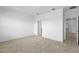 Bright bedroom with neutral carpet and white walls leading to a window at 13528 Autumn Harvest Ave, Winter Garden, FL 34787