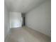 Spacious, unfinished bedroom with clean lines and natural light from a window at 13528 Autumn Harvest Ave, Winter Garden, FL 34787