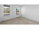 Bedroom with carpet, two windows and neutral colored walls at 13528 Autumn Harvest Ave, Winter Garden, FL 34787