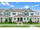Charming townhome featuring a covered porch, and well-maintained landscaping at 13528 Autumn Harvest Ave, Winter Garden, FL 34787