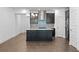 Modern kitchen featuring a large island with seating and stainless steel appliances at 13528 Autumn Harvest Ave, Winter Garden, FL 34787