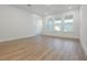 Bright living area with hardwood floors, large windows, and ample natural light at 13528 Autumn Harvest Ave, Winter Garden, FL 34787