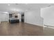 Open concept living space with hardwood floors connecting kitchen and living areas at 13528 Autumn Harvest Ave, Winter Garden, FL 34787