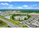 Stunning aerial view of lake, community park and new homes in a vibrant neighborhood setting at 13536 Autumn Harvest Ave, Winter Garden, FL 34787
