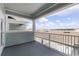 This balcony features a painted ceiling, vinyl siding and railing, with ample space for outdoor furniture at 13536 Autumn Harvest Ave, Winter Garden, FL 34787