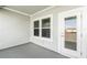 Outdoor balcony space with gray tones and a view of the neighborhood at 13536 Autumn Harvest Ave, Winter Garden, FL 34787