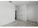 This is a carpeted bedroom with white walls, white trim, and a large closet with white doors at 13536 Autumn Harvest Ave, Winter Garden, FL 34787