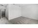 A bright bedroom with plush carpeting, crisp white walls, and an adjoining doorway at 13536 Autumn Harvest Ave, Winter Garden, FL 34787