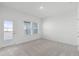 Bedroom with carpet, white walls, access to the outdoor balcony and natural light at 13536 Autumn Harvest Ave, Winter Garden, FL 34787