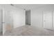 Bedroom with carpet, white walls, and an adjoining doorway to the bathroom at 13536 Autumn Harvest Ave, Winter Garden, FL 34787