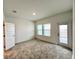 Bedroom featuring carpet floors, natural light, and access to a private balcony at 13536 Autumn Harvest Ave, Winter Garden, FL 34787