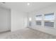 Bedroom with carpet, white walls, natural light and access to an outdoor balcony at 13536 Autumn Harvest Ave, Winter Garden, FL 34787
