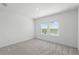 Cozy bedroom with carpet flooring, and an abundance of natural light flooding through the windows at 13536 Autumn Harvest Ave, Winter Garden, FL 34787