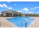 Bright community pool with a covered pavilion, and convenient access for all, creating a vibrant social hub at 13536 Autumn Harvest Ave, Winter Garden, FL 34787
