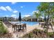 Inviting community pool area with ample seating, umbrellas, and a covered pavilion, perfect for social gatherings at 13536 Autumn Harvest Ave, Winter Garden, FL 34787
