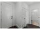 The entryway has dark wood floors and white walls, with a bathroom visible through an open door at 13536 Autumn Harvest Ave, Winter Garden, FL 34787
