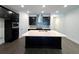 Modern kitchen boasts a large center island, stainless steel appliances, and dark cabinetry at 13536 Autumn Harvest Ave, Winter Garden, FL 34787