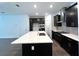 Stylish kitchen featuring a large island, sleek stainless-steel appliances, and ample cabinetry at 13536 Autumn Harvest Ave, Winter Garden, FL 34787