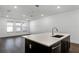 Bright living room with dark wood floors, recessed lighting, and large windows at 13536 Autumn Harvest Ave, Winter Garden, FL 34787