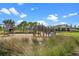 Community playground with swings, slides, and houses at 13536 Autumn Harvest Ave, Winter Garden, FL 34787
