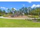Playground with swings and slides in a well-maintained community park at 13536 Autumn Harvest Ave, Winter Garden, FL 34787