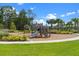 Community playground with slides, swings, and greenery at 13536 Autumn Harvest Ave, Winter Garden, FL 34787