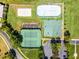 An aerial view of the tennis courts, basketball court, hockey rink, and volleyball court at 13722 Fox Glove St, Winter Garden, FL 34787