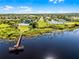 An aerial view of a community area featuring a pool, clubhouse, tennis court, and hockey rink at 13722 Fox Glove St, Winter Garden, FL 34787