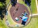 Aerial of playground showing the swing set, slide, and benches on a mulch bed at 13722 Fox Glove St, Winter Garden, FL 34787