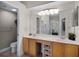 Bathroom with a double sink vanity, large mirror and plenty of storage at 13722 Fox Glove St, Winter Garden, FL 34787