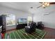 Bonus room featuring wood floors, a football-themed rug, and plentiful natural light at 13722 Fox Glove St, Winter Garden, FL 34787