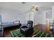 Bonus room featuring wood floors, a football-themed rug, and plentiful natural light at 13722 Fox Glove St, Winter Garden, FL 34787